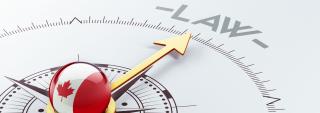 Canadian compass pointing to the word "LAW"