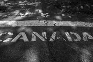 US-Canada border, painted on road