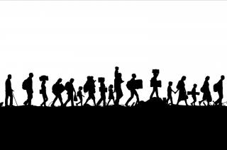 Line of human silhouettes walking
