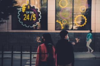 2 people standing outside